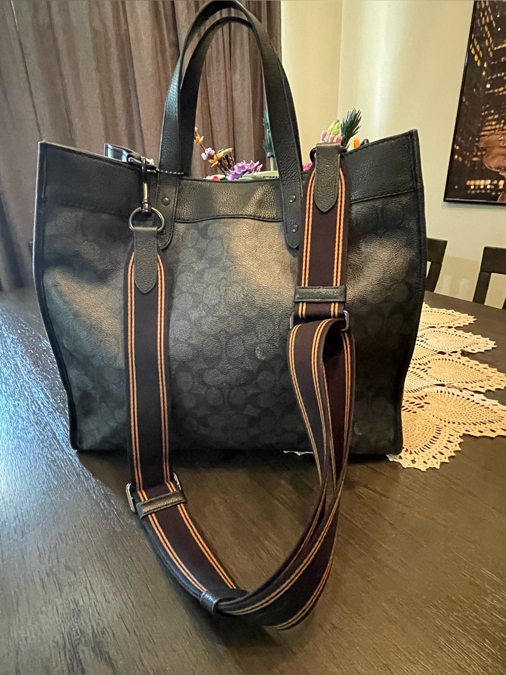 Coach Field Tote 40 is crafted from charcoal signature coated canvas and refined